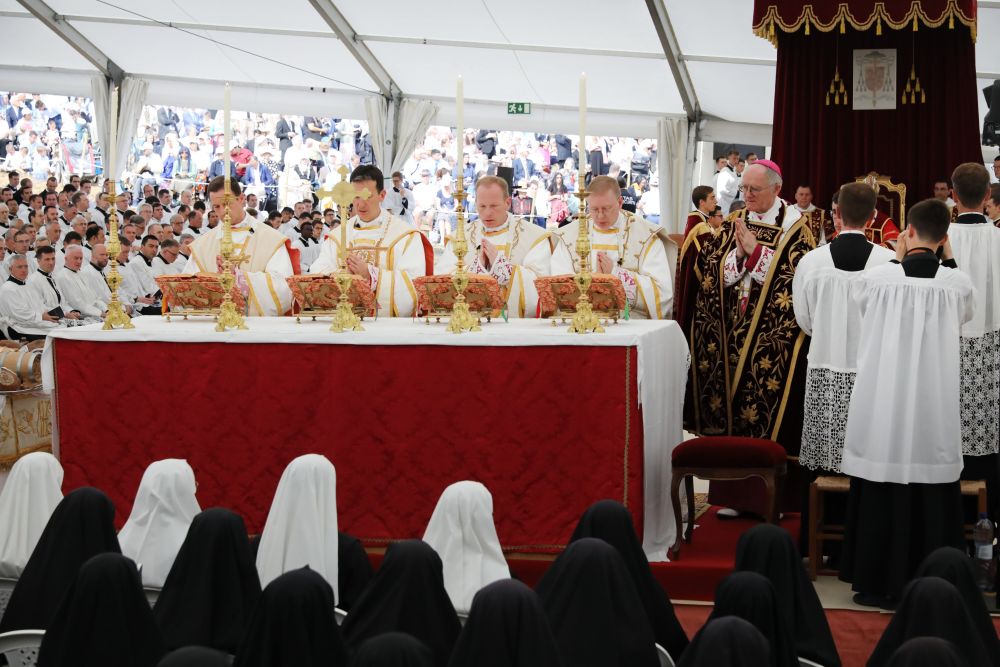 Newly consecrated Society of St. Pius X bishops stand at the altar during a liturgical celebration with Bishop Bernard Fellay of SSPX, right, on July 1, 2026, in Écône, Switzerland. The five bishops, along with Bishop Alfonso de Galarreta, leading the celebration, were excommunicated by the Vatican July 2. (OSV News/CPP)
