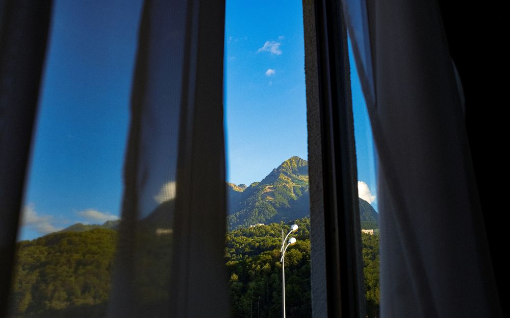 Mountain seen through window.