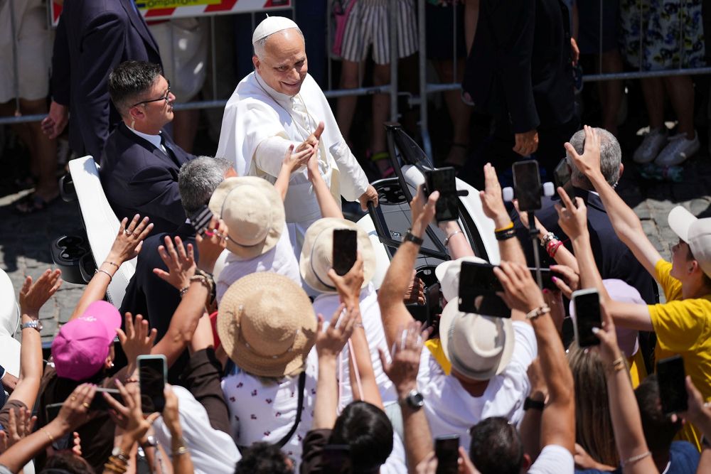 Pope Leo XIV greets the faithful gathered in the square in front of the Apostolic Palace for the noon Angelus prayer, in Castel Gandolfo, on the outskirts of Rome, July 12, 2026. (RNS/AP/Andrew Medichini)