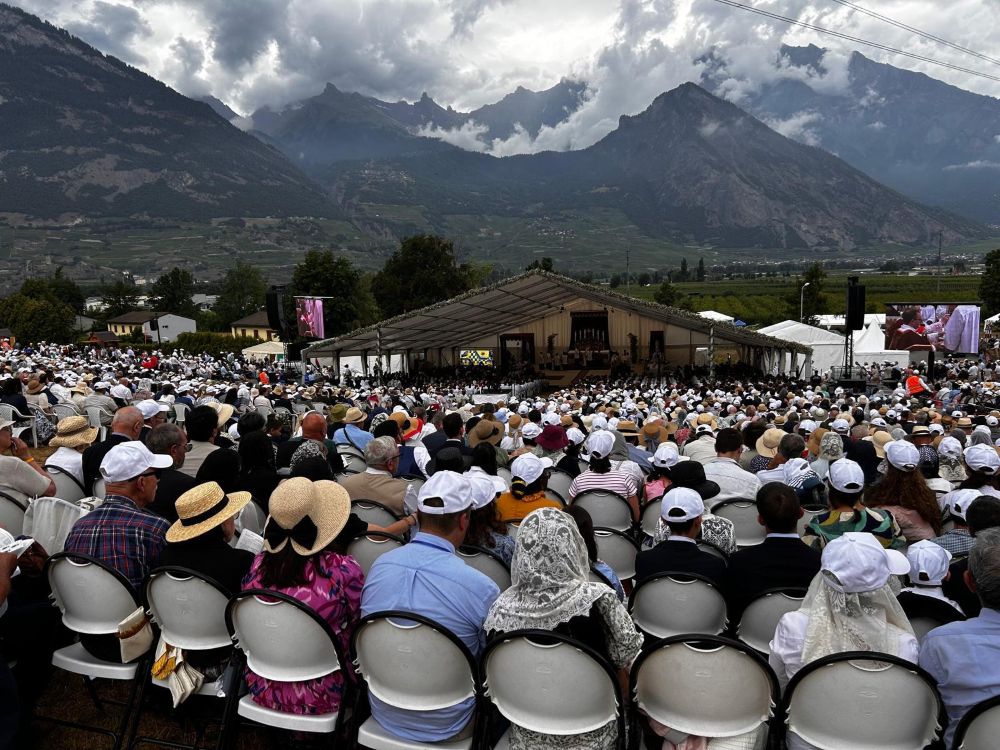 People attend a Mass for illicit bishop consecrations held at the international seminary for the Society of St. Pius X in Écône, Switzerland, July 1, 2026. Organizers said more than 16,000 people attended the Mass. (NCR photo/Justin McLellan)