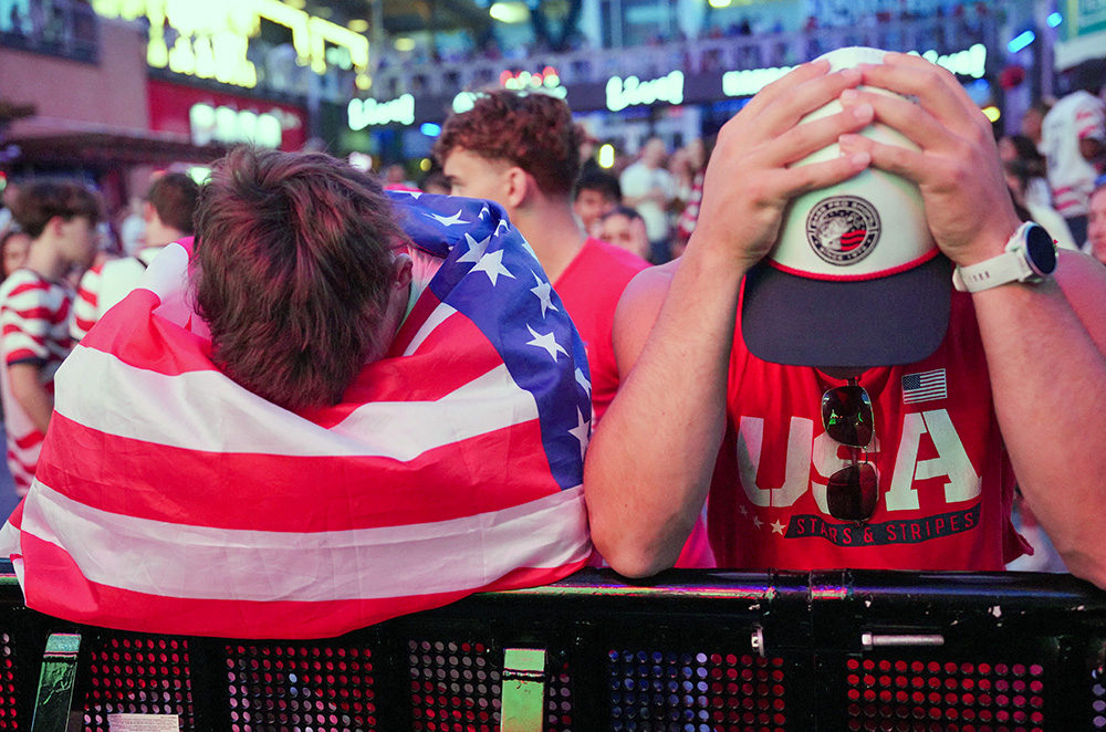 U.S. fans react in Portland, Ore., July 6, 2026, after the United States was eliminated from the FIFA World Cup. The United States men's national soccer team ended its run following a 4-1 defeat to Belgium in the teams' round of 16 game. (OSV News/Reuters/Denny Medley)
