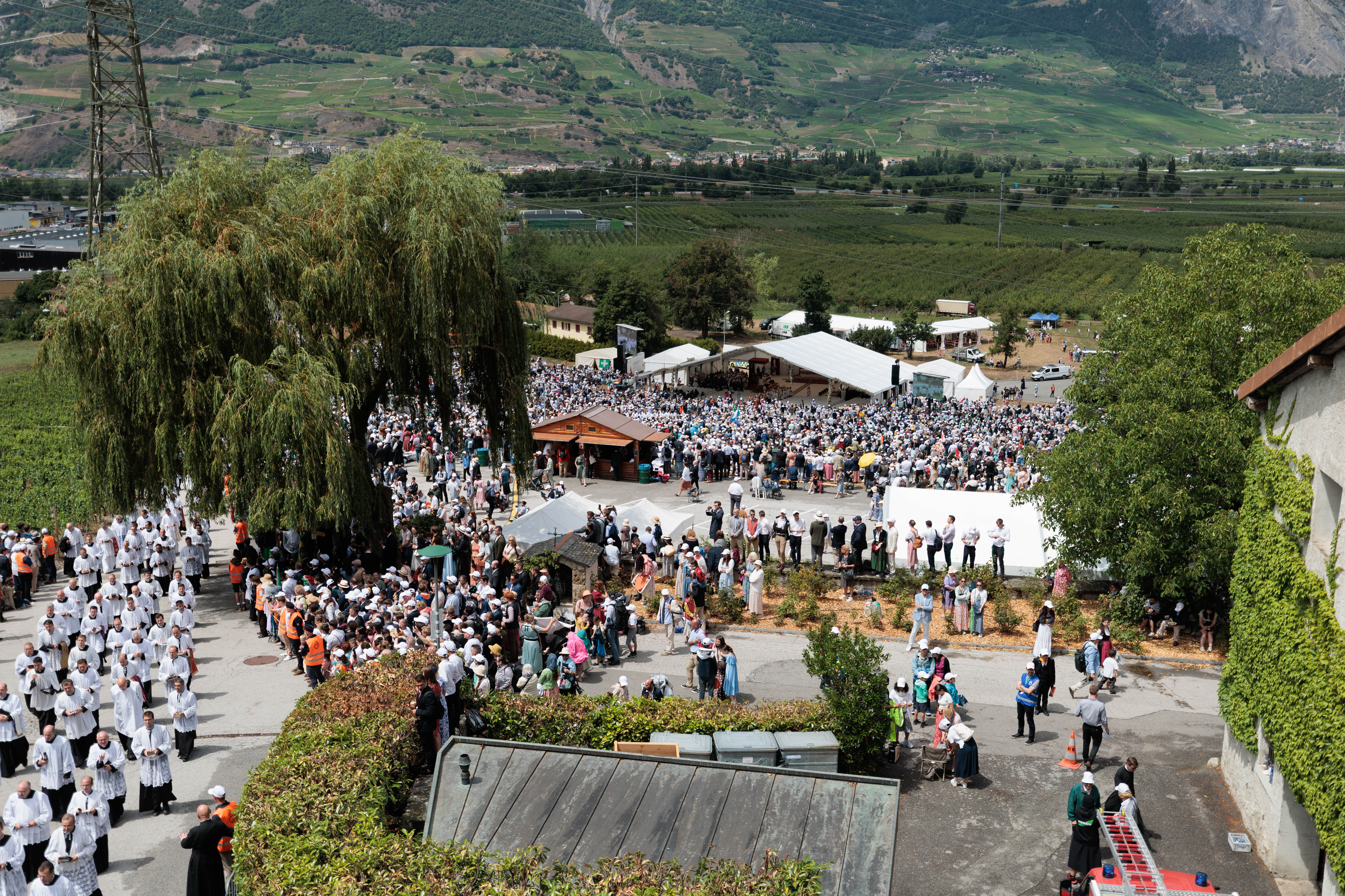 Crowds gather during an illicit consecration Mass in Écône, Switzerland, celebrated by the Society of St. Pius X on July 1, 2026 . The following day, the Vatican declared the new bishops and those who consecrated them to be schismatic, as well as all clergy and lay faithful who adhere to the schism. (Courtesy of the Society of St. Pius X)