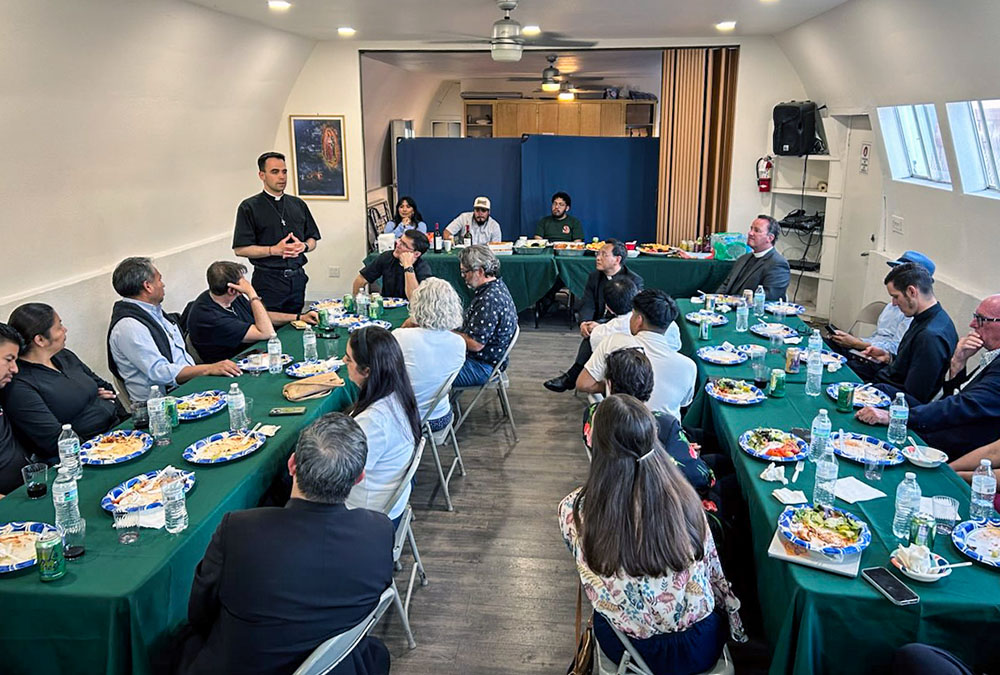 Fr. Mattia Ferrari, standing at left, addresses a gathering of bishops and community leaders, June 22, 2026, in San Diego. (Courtesy of Catholics in Communion)