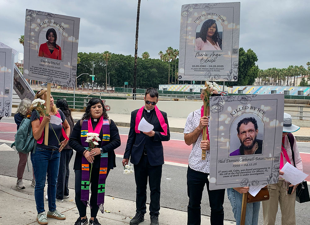 Fr. Mattia Ferrari, center, coordinator of World Meeting of Popular Movements, attends a prayer vigil in front of the Federal Building in Los Angeles. (Courtesy of LA Voice)