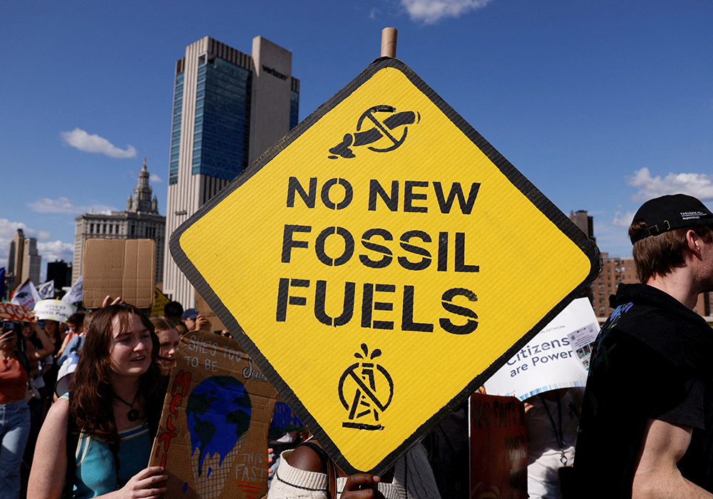 Demonstrators march across the Brooklyn Bridge in New York City Sept. 20, 2024, to call for an end to the era of fossil fuels. (OSV News/Reuters/Shannon Stapleton)
