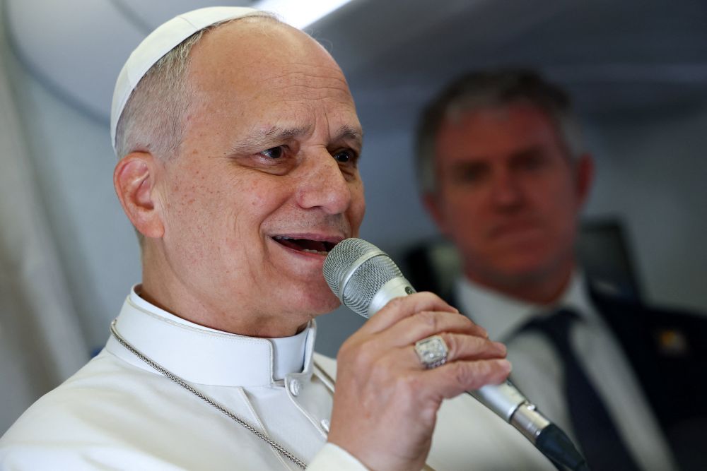 Pope Leo XIV speaks to members of the media aboard the papal plane April 15, 2026, en route to Yaounde, Cameroon. Leo will visit 10 cities in South America during his apostolic journey to Uruguay, Argentina and Peru Nov. 6-17. (OSV News/Pool/Guglielmo Mangiapane)