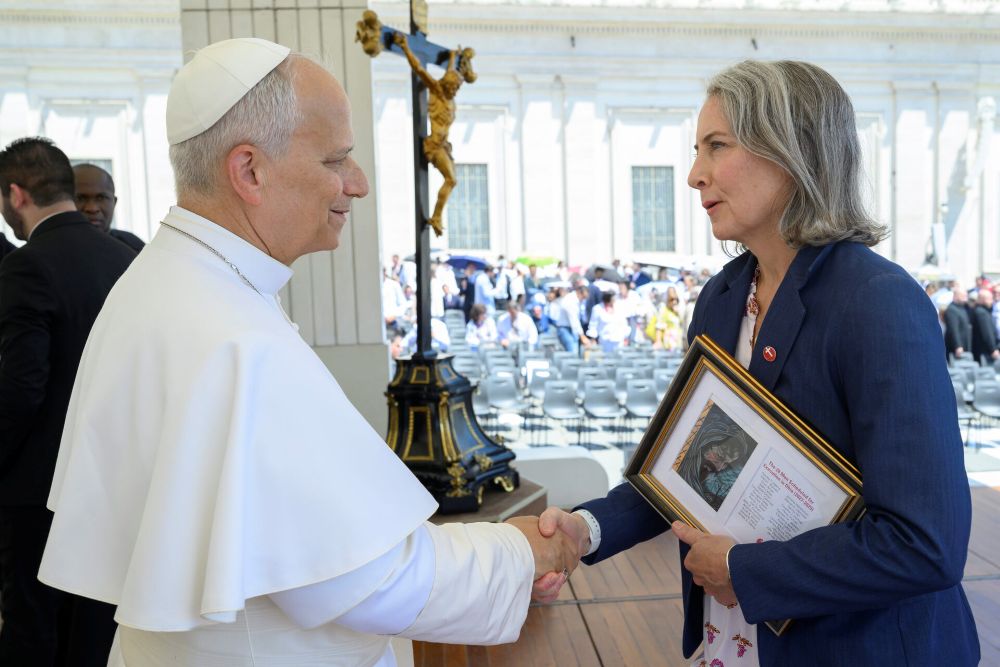 Krisanne Vaillancourt Murphy meets Pope Leo XIV on June 17, 2026, and gives him a framed drawing from a man on Ohio's death row with 28 names of men who have scheduled execution dates. (Courtesy of Vatican Media)