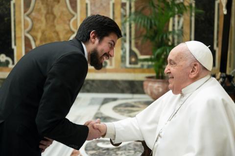 Pope Francis shakes hands with Justin McLellan during a meeting with members of the International Association of Journalists Accredited to the Vatican (AIGAV) at the Vatican January 22, 2024. (Courtesy Justin McLellan)