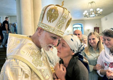  A woman speaks with Metropolitan Archbishop A. Gudziak of the Ukrainian Greek Catholic Archeparchy of Philadelphia Sept. 8, 2024, following Divine Liturgy at St. Nicholas the Wonderworker Ukrainian Greek Catholic Church in Kharkiv, Ukraine. Archbishop Gudziak said the Alaska summit between U.S. President Donald Trump and Russian President Vladimir Putin held on Aug. 15, 2025, has ultimately failed to address the "fundamental moral and geopolitical questions" of Russia's multiyear war on Ukraine. (OSV News 