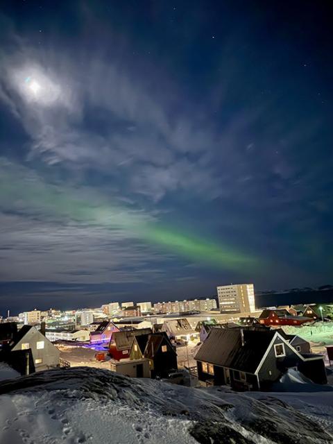 The northern lights are seen over the city of Nuuk, the capital of Greenland, in this undated photo provided by Father Tomaž Majcen, a Conventual Franciscan, and the only Catholic parish priest serving in Greenland. Father Majcen says talks about a U.S. takeover are being met with concern, fear and "a quiet strength" by residents. (OSV News/Fr. Tomaž Majcen)