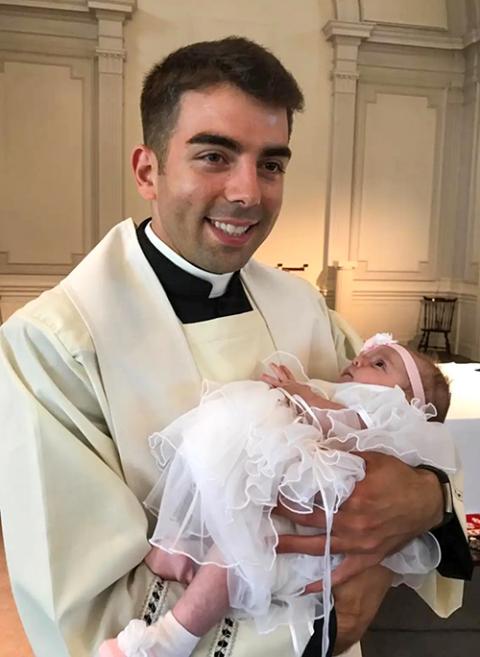 Fr. Jonathan Ficara holds his niece, Jenna, following her baptism in 2017. (Courtesy of Jonathan Ficara)