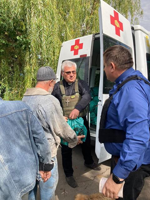 Cardinal Konrad Krajewski, prefect of the Vatican Dicastery for the Service of Charity, distributes humanitarian aid in Zaporizhzhia, eastern Ukraine in September 2022. (OSV News/courtesy Dicastery for the Service of Charity)