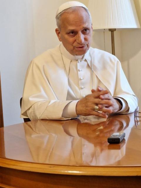 Pope Leo XIV answers a question from Elise Allen, senior correspondent at Crux, during an interview at the pope's residence inside the Vatican's Palazzo Sant'Uffizio July 30 (CNS/Courtesy of Crux)