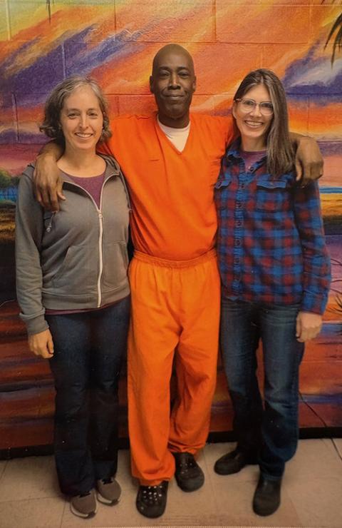 Susan Kaspari, right, is pictured with Billy "Pyth" Kearse, center, during her November 2025 visit to Kearse at the Union Correctional Institution in Raiford, Florida. (Courtesy of Susan Kaspari)