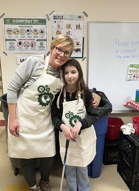 Jamie Hasemeier and her daughter Ruby help sort discarded items into bins during a fish fry at Holy Redeemer Catholic Church, in Webster Groves, Missouri. (Courtesy of Jamie Hasemeier)