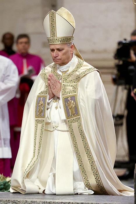 Pope Leo XIV kneels in prayer at the threshold of the Holy Door in St. Peter's Basilica before closing it Jan. 6, 2026, marking the end of the Jubilee Year. Leo will visit four countries in his 11-day tour of the African continent. (CNS/Pool, Franco Origlia)