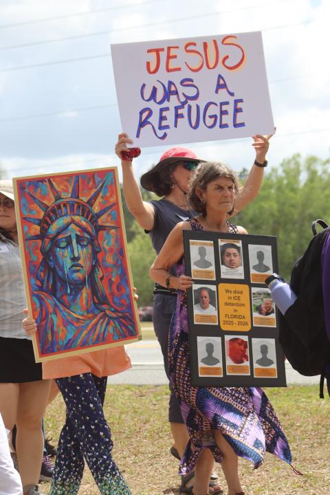 Immigrant advocates from across north Florida held signs as they prayed, sang and walked towards Deportation Depot in Sanderson, Fla, Good Friday April 3, 2026. The institution formerly served as Baker County Correctional and is now used to house immigrant detainees. 