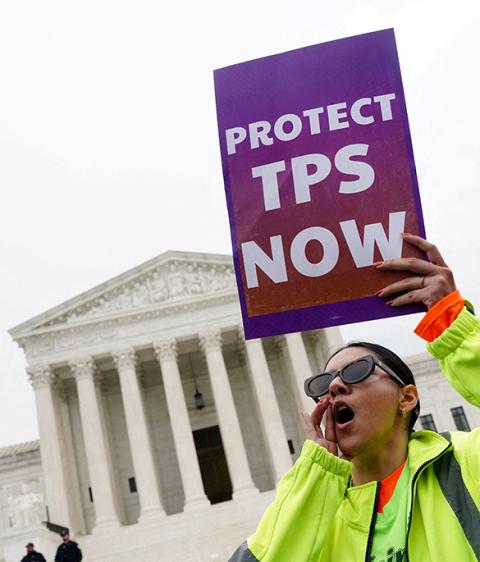 A woman holds a placard as immigrants' rights activists and demonstrators attend a rally outside the U.S. Supreme Court in Washington April 29, 2026. (OSV News/Reuters/Nathan Howard)