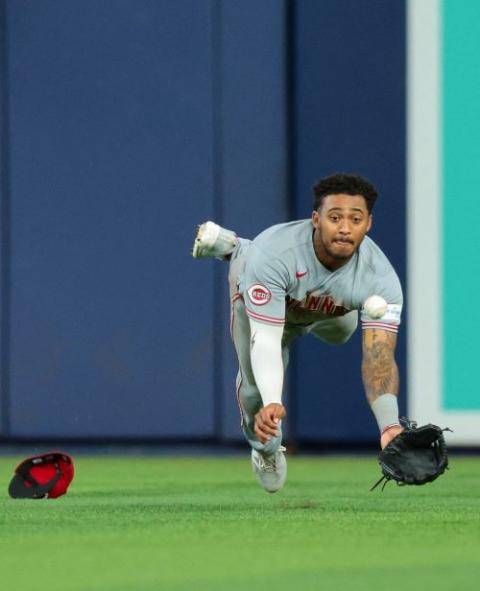 Cincinnati Reds center fielder Dane Myers (17) dives for a ball against Miami Marlins catcher Agustin Ramirez during the eighth inning at loanDepot Park in Miami April 9. (OSV News/Sam Navarro-Imagn Images via Reuters)