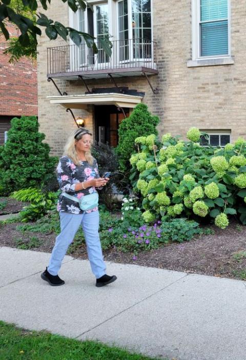 Rev. Vicki Garlock walks in the streets of Chicago as she works to set a Guinness World Record for most places of worship visited in one month, September 2025. (Courtesy of Vicki Garlock)