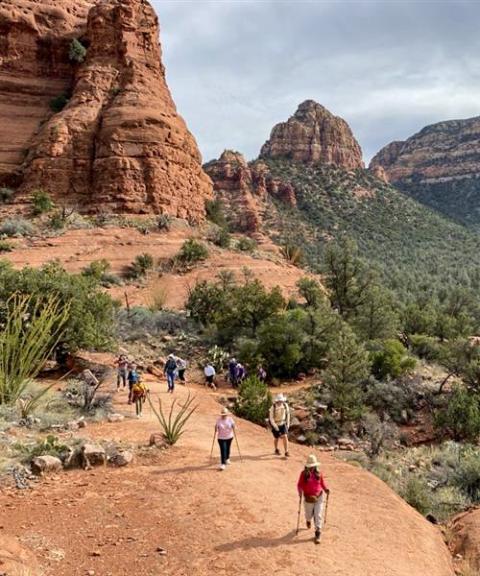 Hikers walk along the desert landscape and red rock formations of Sedona, Arizona, as part of a Pilgrimage of Hope for Creation in November 2025 organized by the Phoenix Diocese to celebrate the Jubilee Year of Hope. (Courtesy of Phoenix Diocese)