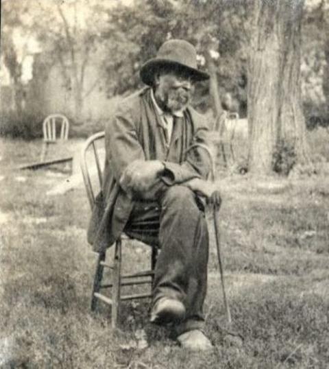 Peter Hawkins poses in 1905 at the Jesuits' St. Stanislaus Novitiate and Farm in Florissant, Missouri, for a photo taken by Jesuit Fr. William Grace. Hawkins was born in 1824. His parents had been sold from the Jesuit plantation in White Marsh, Maryland, in 1823. (Courtesy of the Jesuit Archives and Research Center.)