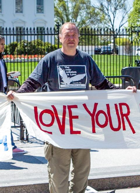 Art Laffin participates in a protest for peace outside of the White House in 2016. (CNS/Chaz Muth)