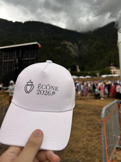 A cap distributed to Mass attendees is pictured ahead of the illicit bishop consecrations held at the international seminary for the Society of St. Pius X in Écône, Switzerland, July 1, 2026. (NCR photo/Justin McLellan)
