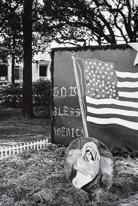 Leonard Freed, God Bless America — sign in private garden in South Carolina, 1964, gelatin silver print. Fairfield University Art Museum, Gift of anonymous benefactors, 2025 (2025.35.95) © Leonard Freed / Magnum Photos.