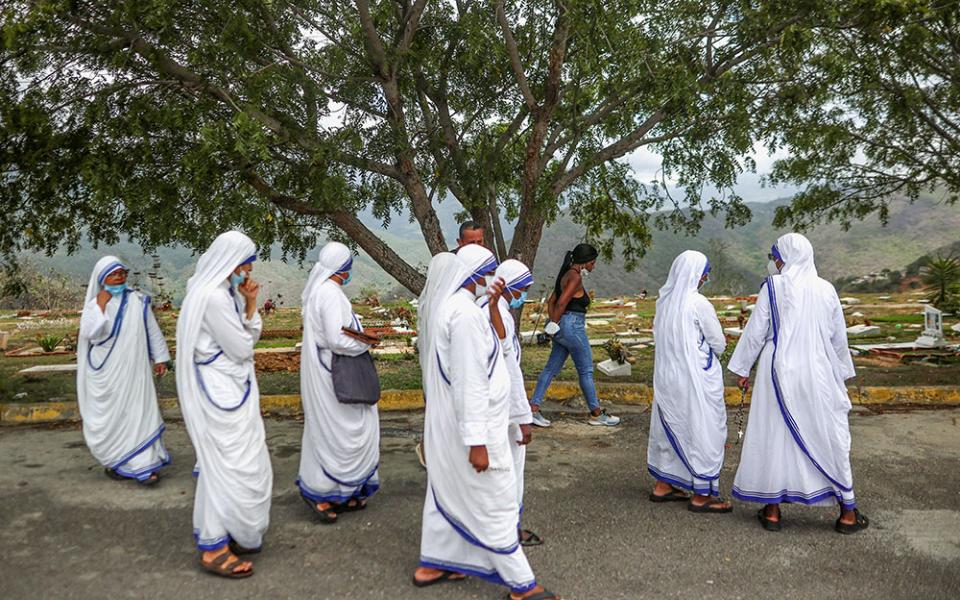 Members of the Missionaries of Charity walk after accompanying a burial for earthquake victims at La Esperanza Cemetery in La Guaira, Venezuela, July 6, 2026. Two catastrophic earthquakes hit Venezuela in quick succession June 24, leaving at least 3,500 dead, which experts say is a major undercount. (OSV News/Reuters/Adriano Machado)