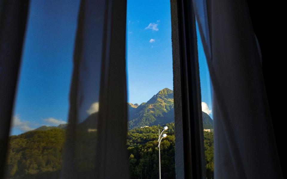 Mountain seen through window.
