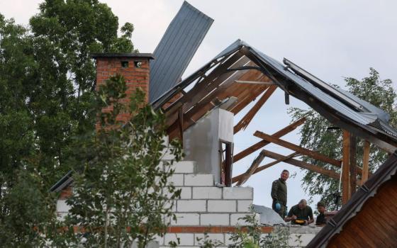 Polish Army members inspect a damaged house in the municipality of Wyryki, Poland, Sept. 10 after a drone or similar object struck a residential building according to local authorities, following violations of Polish airspace during a Russian attack on Ukraine. (OSV News/Reuters/Kacper Pempel)