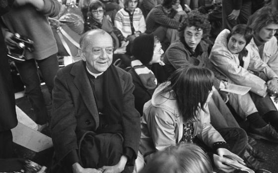 Helder Camara sitting in a crowd