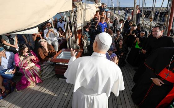 Pope Leo XIV speaks to young adults aboard the "Bel Espoir" ("Beautiful Hope") sailboat in the Ostia marina outside Rome Oct. 17. In rotating crews of 25, young adults have been sailing around the Mediterranean to speak about peace with their peers. (CNS/Vatican Media)