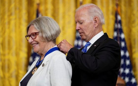 President Joe Biden awards the Presidential Medal of Freedom to Sr. Simone Campbell, a longtime advocate for economic justice and health care policy, during a ceremony at the White House in Washington July 7, 2022. (CNS/Reuters/Kevin Lamarque)