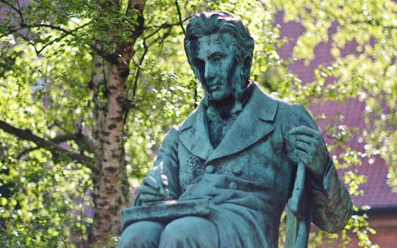 A bronze statue depicting Danish philosopher Soren Kierkegaard