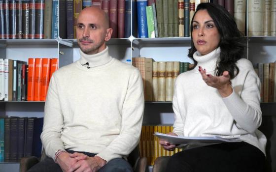 Man and woman sit for interview.