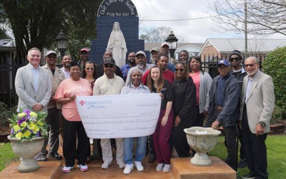 Chad Eachern, president and CEO of Edmundite Missions, far left, poses after presenting checks Feb. 27, 2026, to people participating in the Selma, Ala.-based Catholic social services agency's farming initiative that helps support small farmers in the South's impoverished Black Belt region. (OSV News photo/courtesy Edmundite Missions)
