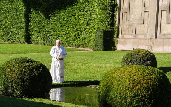 Pope Leo XIV feeds fish at a pond in the Pontifical Gardens of Castel Gandolfo, Italy, Sept. 5, 2025. The pope inaugurated Borgo Laudato Si’ the same day, opening the historic papal residence as a center dedicated to the principles of care for creation and human dignity outlined in Pope Francis’ encyclical Laudato Si’. (CNS/Lola Gomez)