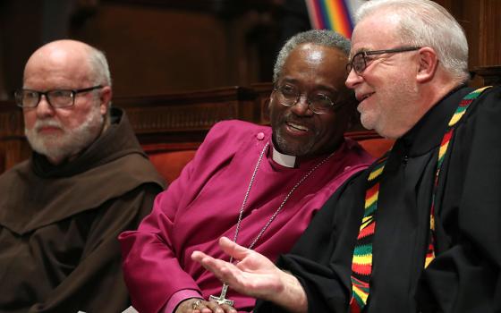 Franciscan Fr. Richard Rohr, Bishop Michael Curry, then-presiding bishop of the Episcopal Church, and the Rev. Jim Wallis, then-president of Sojourners, chat before leading an interfaith vigil titled "Reclaiming the Integrity of Faith During Political and Moral Crisis" May 24, 2018, in Washington. (CNS/Reuters/Jonathan Ernst) 