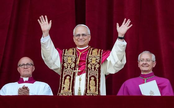 Pope Leo XIV, the former Cardinal Robert F. Prevost, waves to the crowds in St. Peter's Square at the Vatican after his election as pope May 8, 2025. (CNS/Lola Gomez)