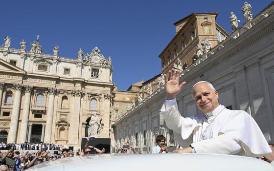 Pope Leo XIV greets visitors and pilgrims from the popemobile while riding around St. Peter’s Square at the Vatican before his weekly general audience May 27, 2026. (CNS/Vatican Media)
