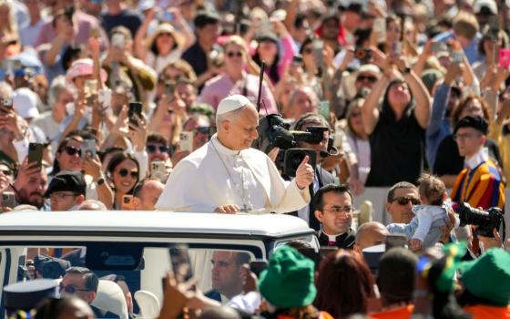 Pope Leo XIV greets visitors and pilgrims from the popemobile while riding around St. Peter's Square at the Vatican before his weekly general audience May 20, 2026. (CNS/Lola Gomez)