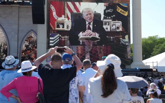 U.S. President Donald Trump speaks during a video message originally shared at an April event and played at "Rededicate 250: A National Jubilee of Prayer, Praise & Thanksgiving" at the National Mall in Washington, May 17, 2026. (OSV News/Reuters/Eric Lee)