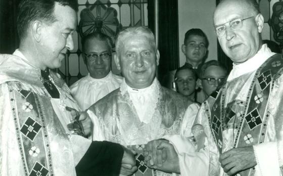 Jesuit Fr. Walter Ciszek, center, is welcomed home in a Mass of Thanksgiving in St. Casimir Catholic Church, Shenandoah, Pennsylvania, following his release from the former Soviet Union, where he was imprisoned and detained for more than 20 years. (Courtesy of Ciszek Society)