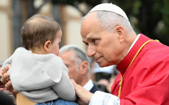Pope Leo XIV greets a child as he arrives to celebrate Mass in Piazza Bartolo Longo in front of the Pontifical Shrine of the Blessed Virgin of the Rosary of Pompeii near Naples, Italy, May 8, 2026, on the first anniversary of his election as the first American pontiff. (OSV News/Vatican Media/Mario Tomassetti)