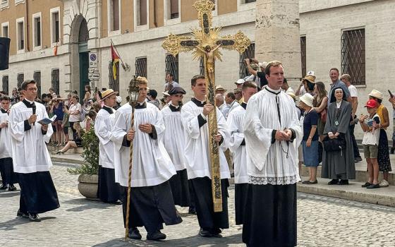 Seminarians and priests walk in procession to the Holy Door of St. Peter's Basilica at the Vatican Aug. 21, 2025. The men were among about 8,000 people who joined a pilgrimage sponsored by the traditionalist Society of St. Pius X. (CNS/Cindy Wooden)