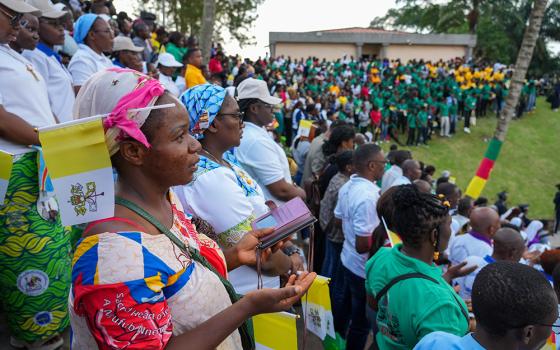 Men and women pray during Pope Leo XIV's meeting with the university community at the Catholic University of Central Africa in Yaoundé, Cameroon, April 17, 2026. (CNS/Lola Gomez)