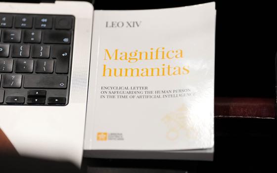 A copy of Pope Leo XIV’s first encyclical, “Magnifica Humanitas: On Safeguarding the Human Person in the Time of Artificial Intelligence,” is seen during a presentation on the document at the Vatican May 25, 2026. (CNS/Lola Gomez)