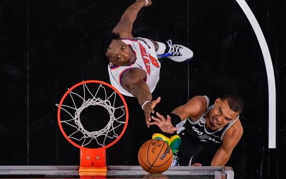 New York Knicks forward Og Anunoby and San Antonio Spurs forward Victor Wembanyama battle for the ball during Game 1 of the 2026 NBA Finals in San Antonio June 3, 2026. (OSV News/Eric Gay-Pool Photo via Imagn Images via Reuters)